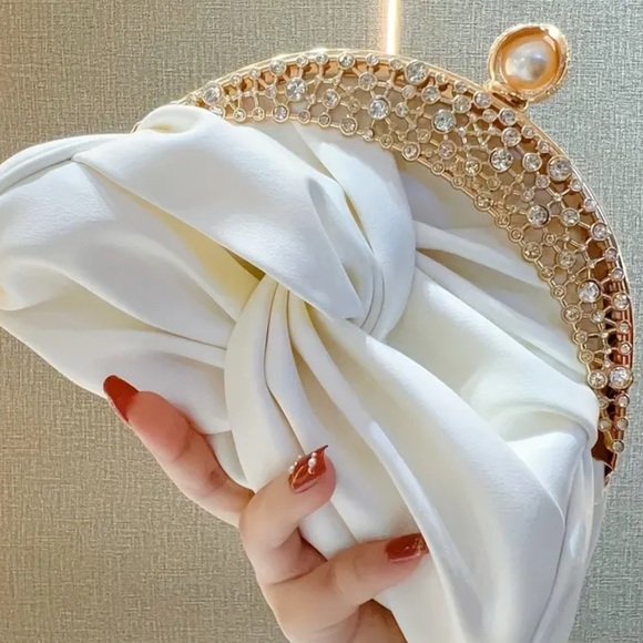 Glamorous White Clutch with Gold and Pearl Details